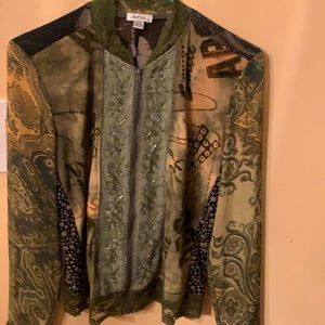 A beautiful green top with any color camisole under it.